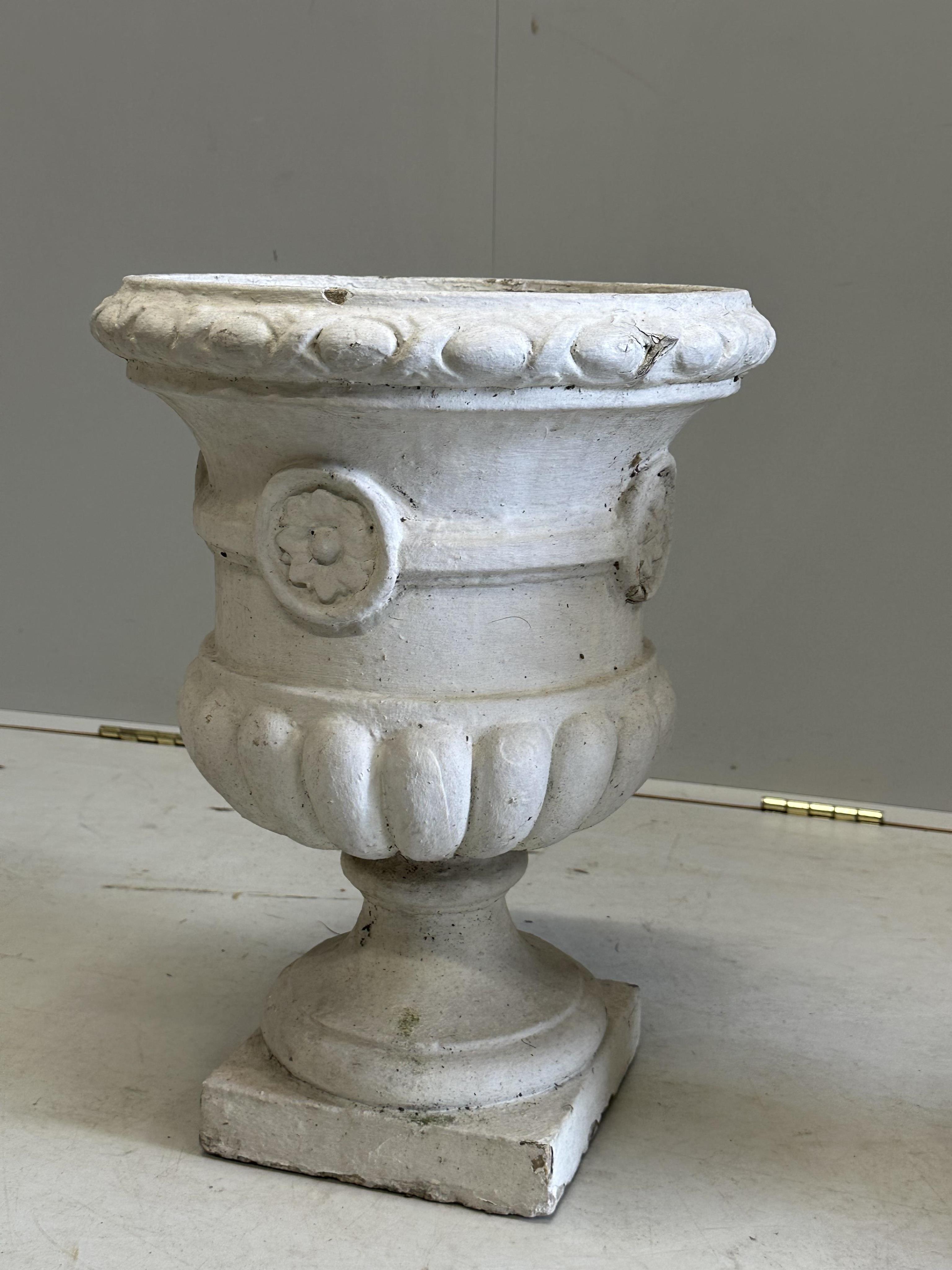 A pair of painted reconstituted stone campana garden urns, diameter 36cm, height 49cm. Condition - poor to fair